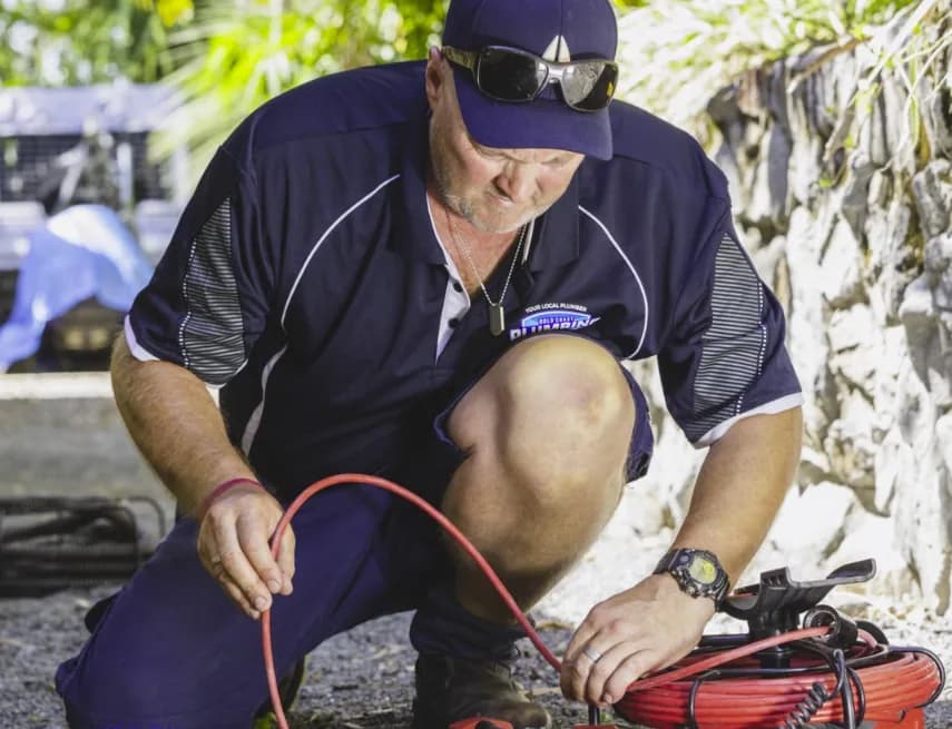 Big Blue Plumbing plumber fixing a pipe on an emergency call-out